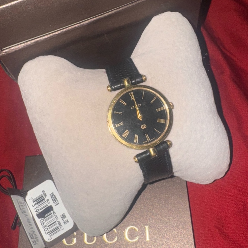 Gucci Black and Gold Watch